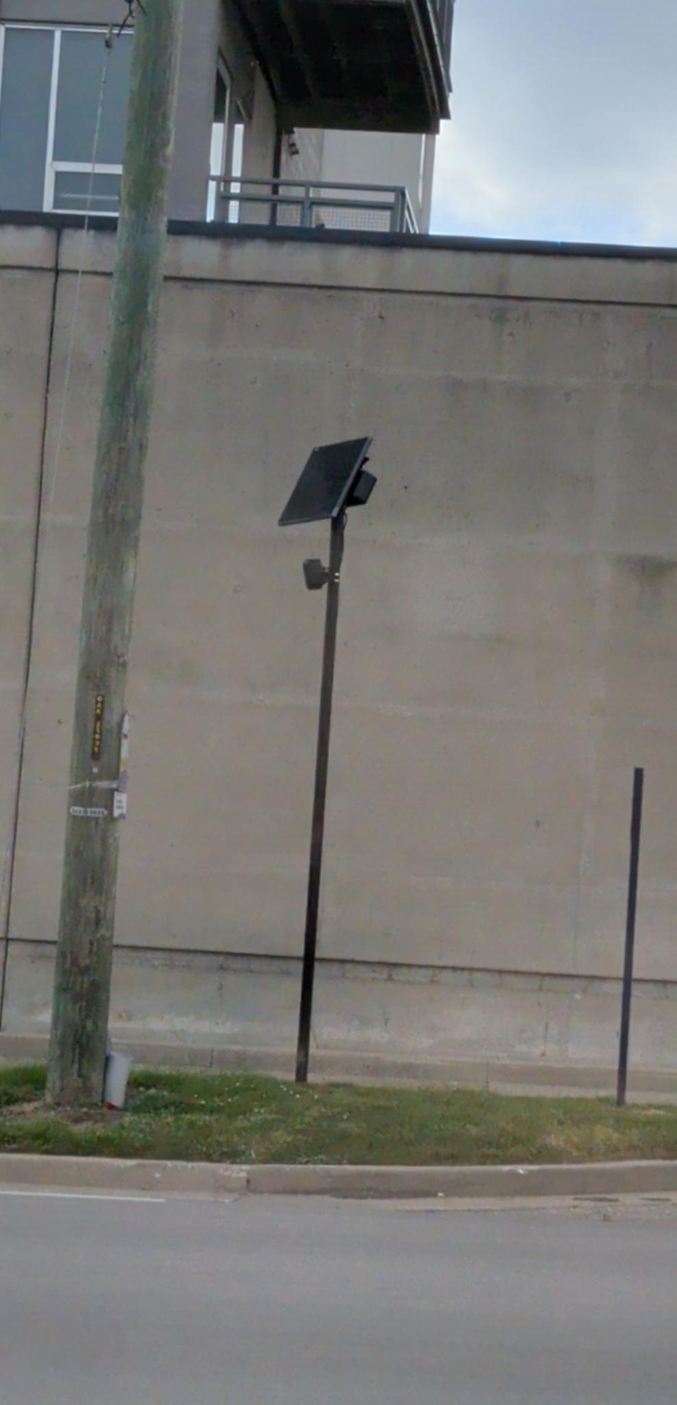 Flock Camera mounted on a pole at Dave Cowens drive near the entrance to south 471