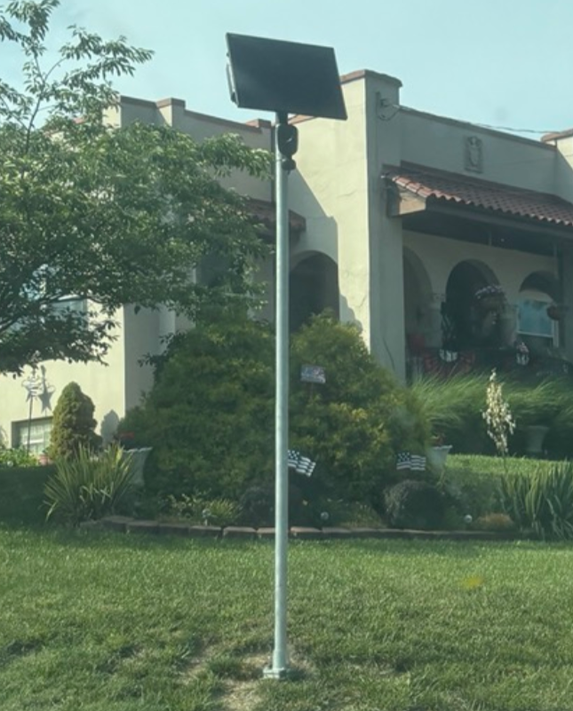 Flock Camera mounted on a pole at Memorial Parkway & Wilson Rd